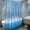 A set of sheer blue crystal texture shower curtain liners hanging in a bathroom