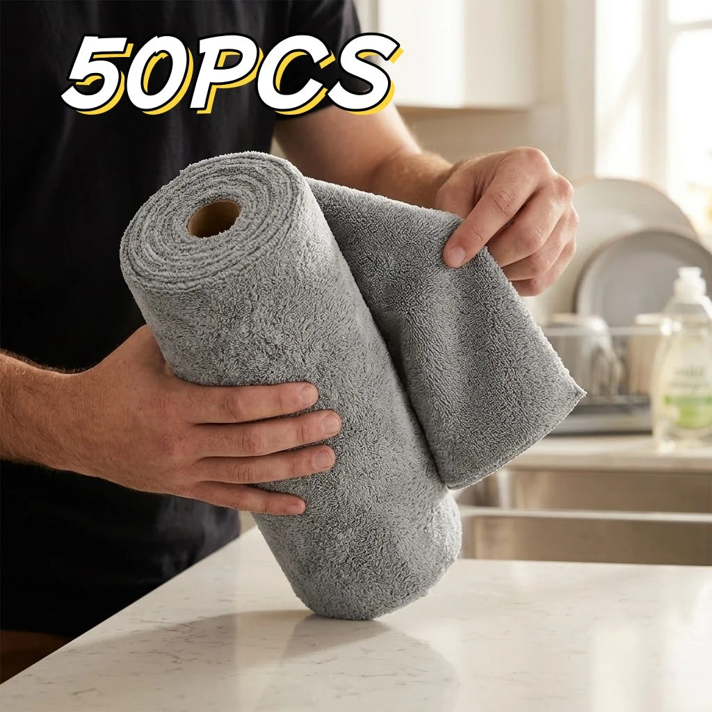 A person is holding a roll of gray microfiber cleaning cloths, showing the texture and size of the reusable product.