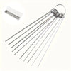 A set of ten stainless steel shower head cleaning brushes with coiled handles and long, thin bristles.