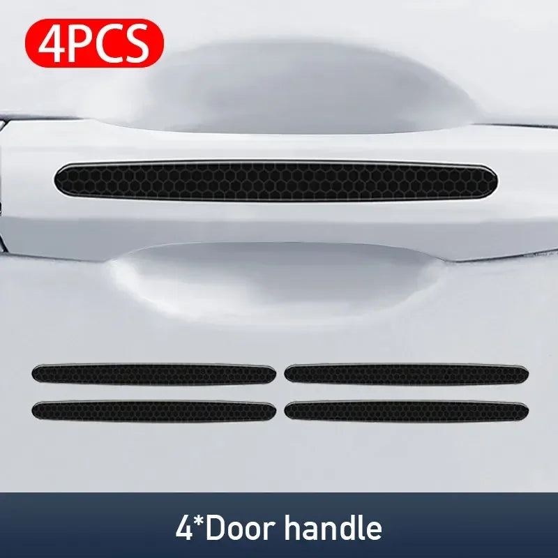 Four carbon fiber door handle protector stickers for car doors.