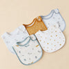 A collection of three cotton baby bibs in white, mustard yellow, and light blue with star patterns.