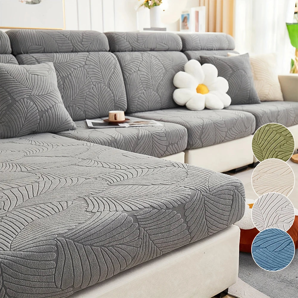Gray stretch jacquard sofa cover featuring a leaf pattern on a modern sectional sofa.