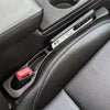 A close-up view of a car seat gap filler organizer with waterproof crevice storage placed in a vehicle console.