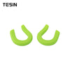 A pair of bright lime green front bumper tow hook covers for Chevrolet Silverado and GMC Sierra trucks.