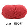 A ball of bright red knitted yarn labeled 79# Deep Red.