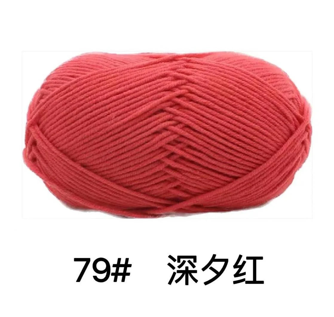A ball of bright red knitted yarn labeled 79# Deep Red.