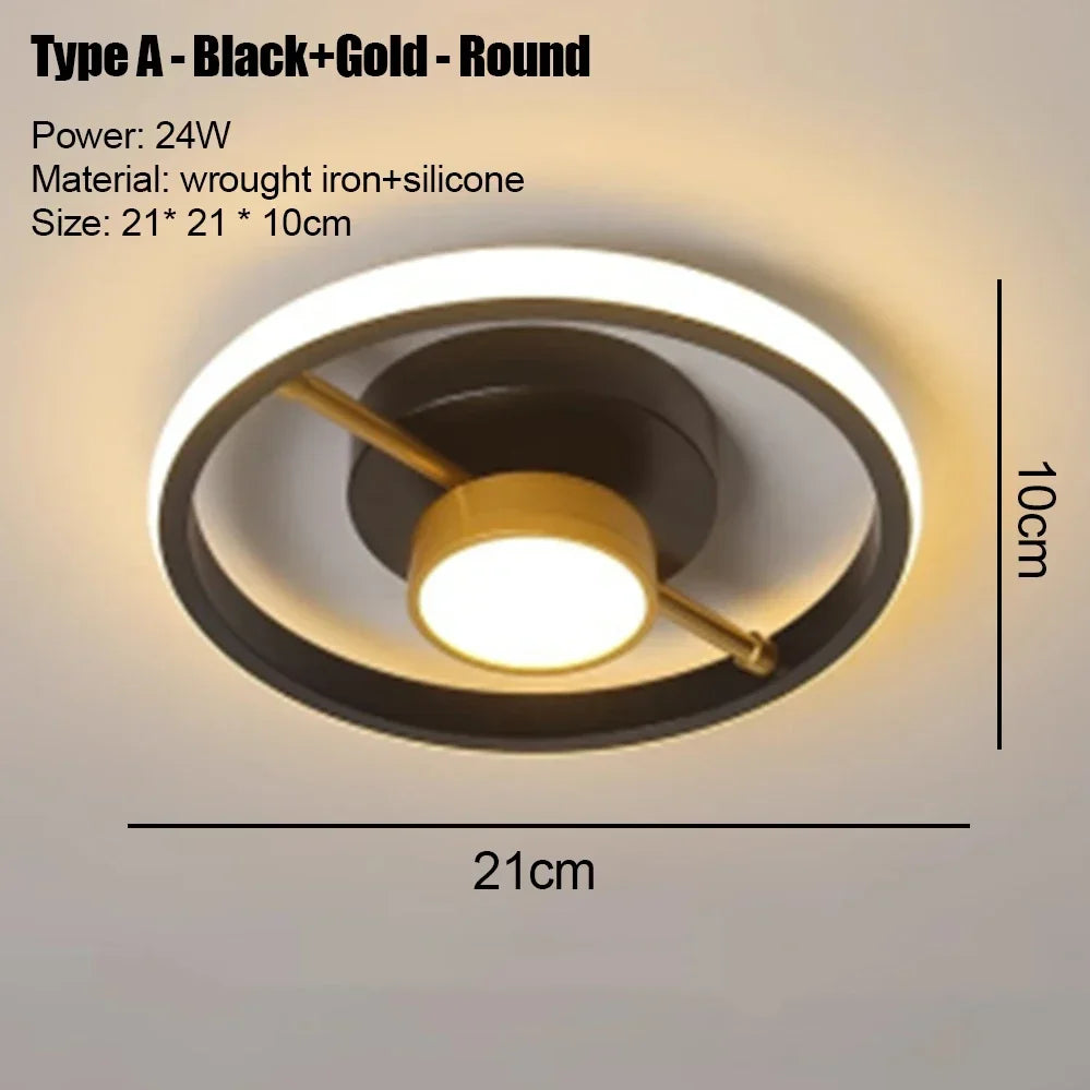 A round black and gold LED ceiling light fixture with a warm glow.
