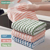 A stack of coral and green velvet cleaning rags is shown next to a hand, highlighting strong water absorption, oil-free prope