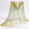 Sheer, pale yellow fabric playsilk draped in a flowing, gathered style for imaginative play.
