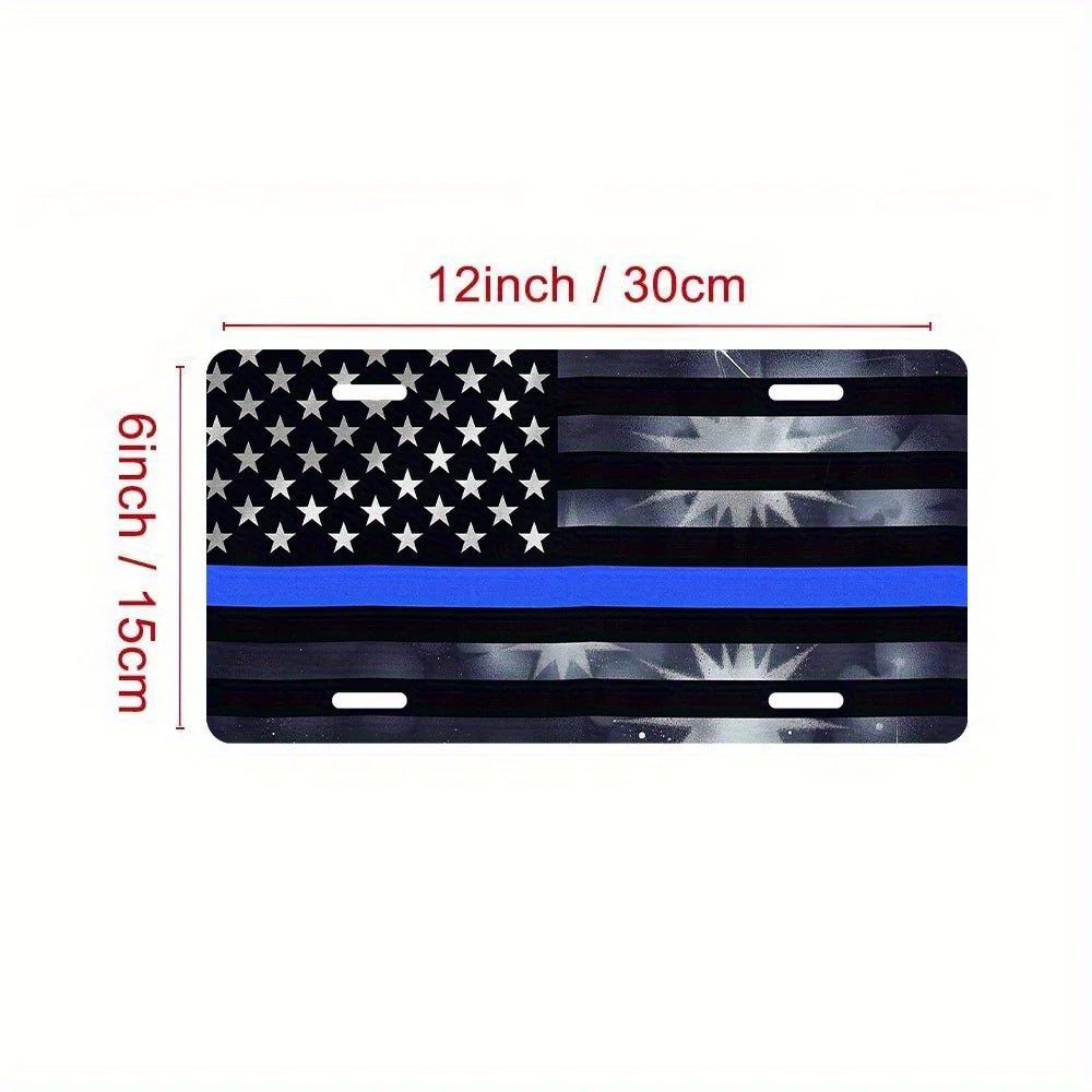 A black and gray metal sign depicting the American flag with a blue stripe, measuring 12 inches by 6 inches.
