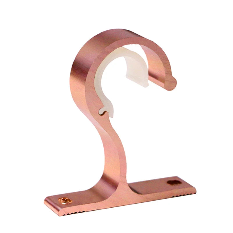 A rose gold curtain rod bracket featuring a curved support and a flat base for secure window treatments.