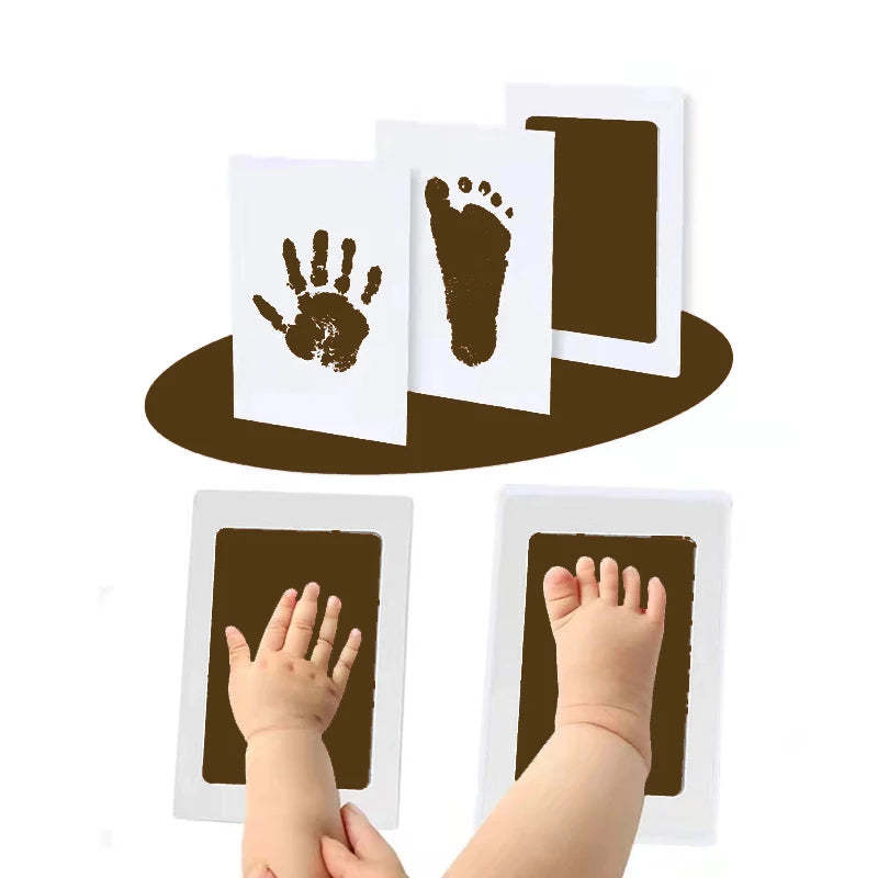 A kit showing a baby's hand and footprint impressions on white cards.