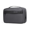 A dark gray waterproof travel toiletry bag with a handle and a logo on the front.