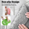 A gray silicone non-slip design scrubber pad for feet and back, shown being used on skin.