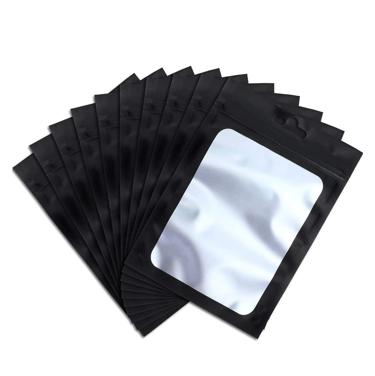 A stack of black mylar ziplock bags with clear windows for jewelry and small item packaging.
