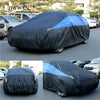 Black waterproof car cover with blue accents protecting a vehicle.
