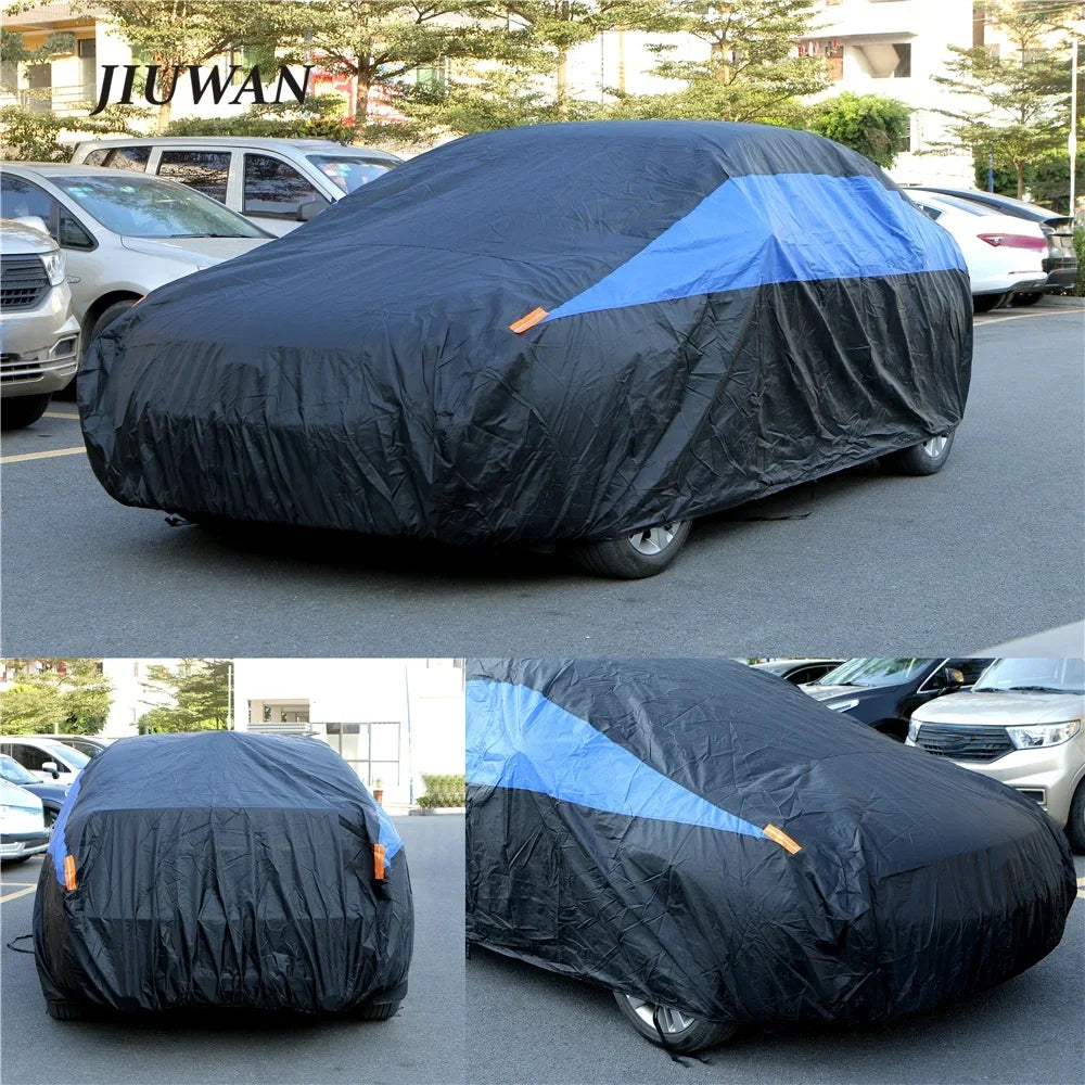 Black waterproof car cover with blue accents protecting a vehicle.