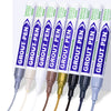 A set of green and purple grout pens with various tips are displayed against a white background.