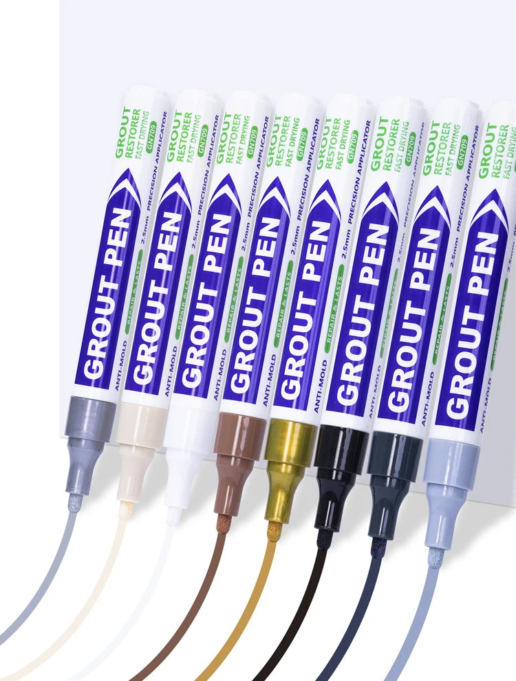 A set of green and purple grout pens with various tips are displayed against a white background.