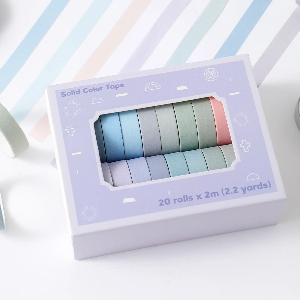 A box of solid color tape with 20 rolls of various pastel colors for crafting and journaling.