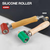 A silicone roller tool with a wooden handle and metal shaft is shown against a white background.