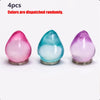Four squishy stress cubes in pink, blue, and purple colors displayed on a white background.