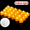 A collection of yellow light heart-shaped flameless LED candles glowing on a black surface.