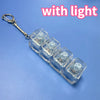A clear acrylic LED mechanical keychain fidget toy with custom keycaps attached to a metal ring.