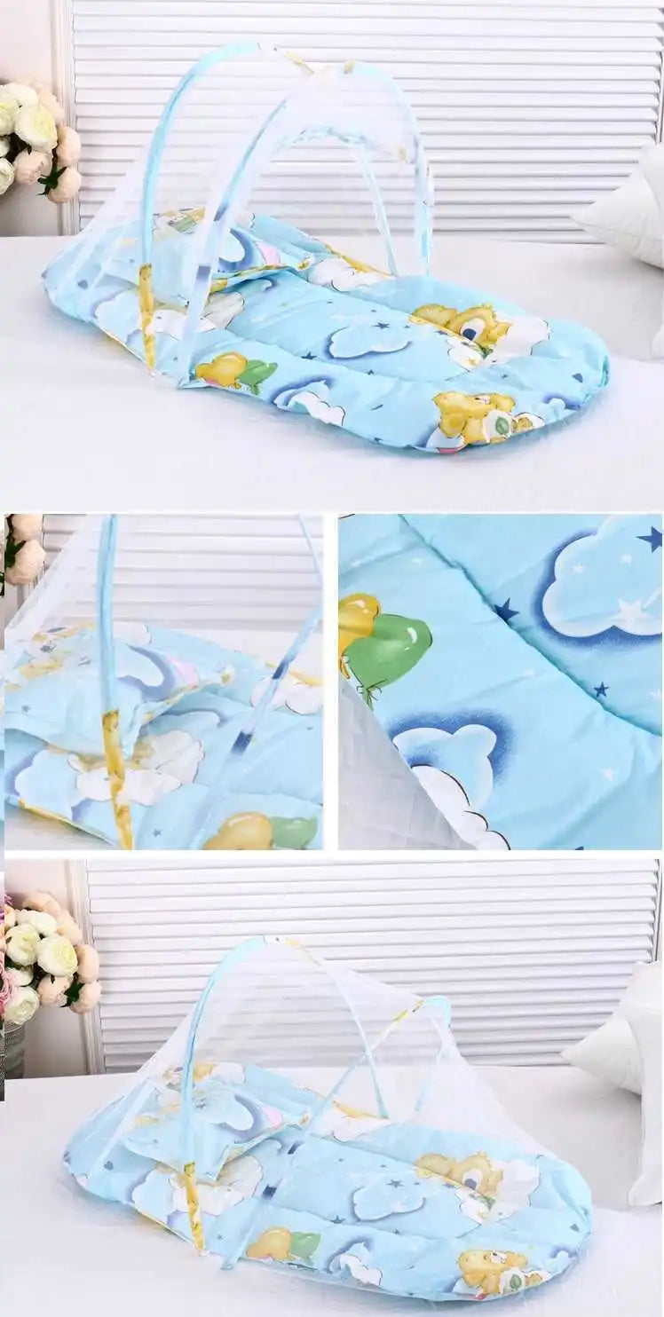 Light blue foldable baby mosquito net with a mattress, pillow, and floral pattern.