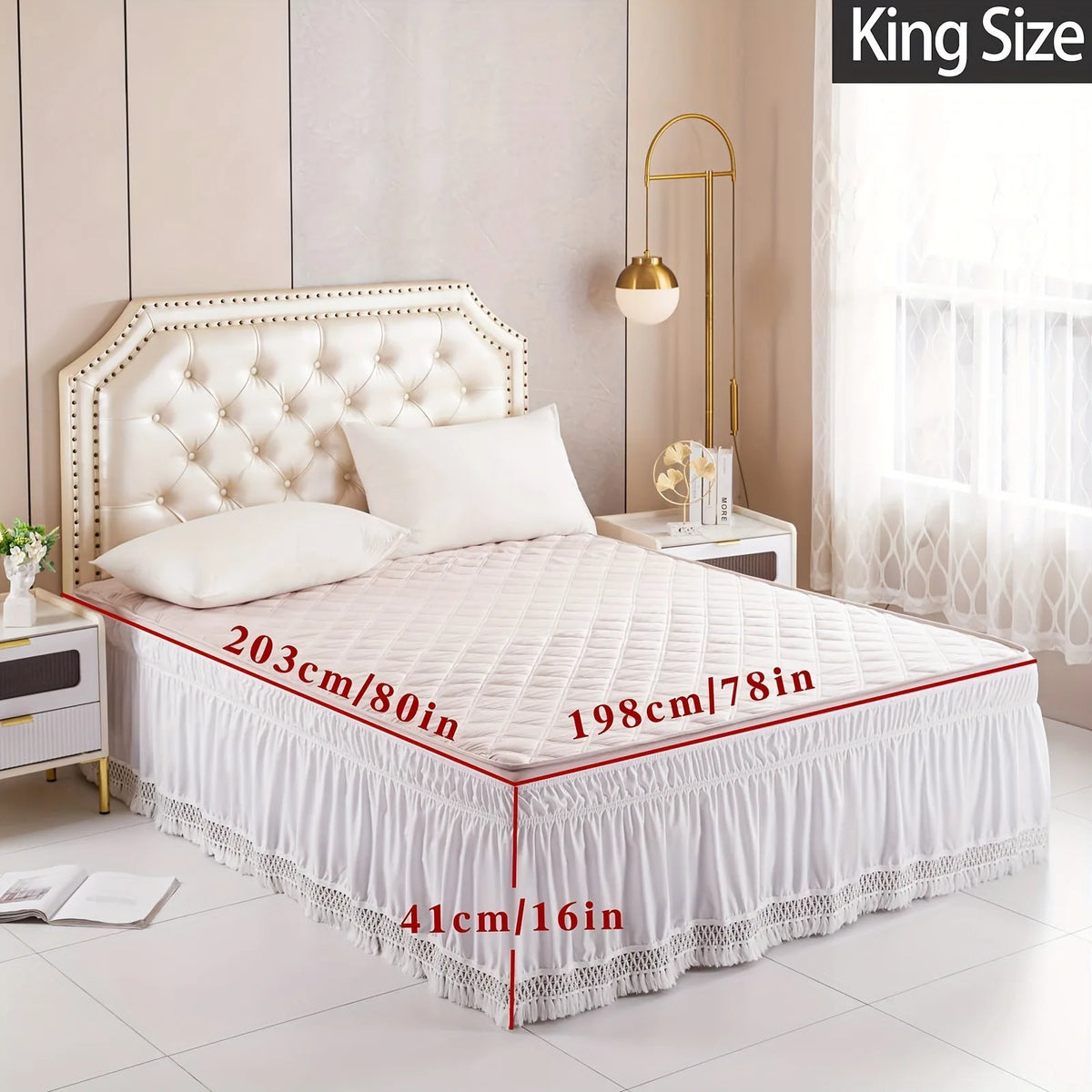 A king-size bed featuring a white quilted headboard and an elastic wrap-around ruffled bed skirt with lace trim.