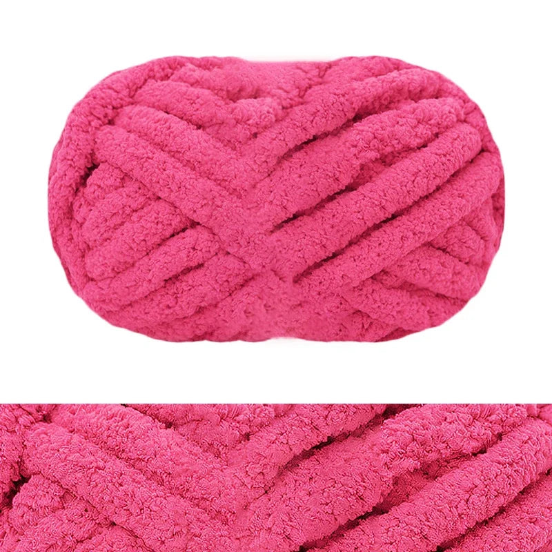 A pink chunky chenille yarn in a ribbed texture, shown flat.