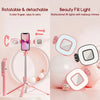 Rosa rotierender Selfie-Stick mit Smartphone neben farbigen Lichtleisten und Make-up-Spiegel