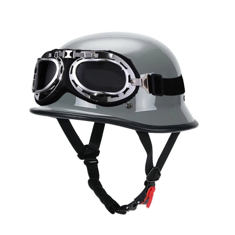 A silver half helmet with integrated goggles is shown for motorcycle and scooter riders.
