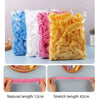 A bundle of pink, white, and yellow disposable shower caps showing natural length 12cm and stretch length 42cm