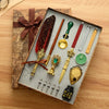 A vintage calligraphy fountain pen set with wax seal stamp kit displayed on aged paper.