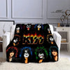 A black flannel throw blanket featuring various printed images of the Kiss band members.