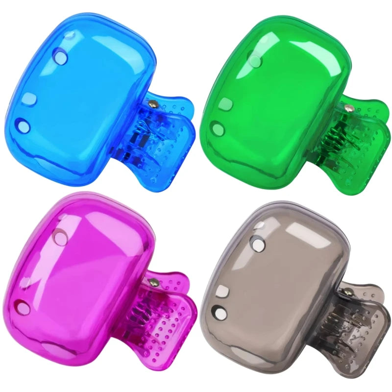 A set of four portable toothbrush head covers in blue, green, pink, and gray with clips.