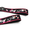 Black strap with pink floral embroidery and JDM Japanese text on a leather keychain.