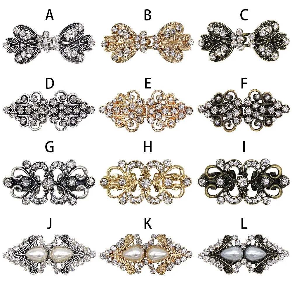 A collection of twelve vintage swirl metal clips in silver and gold tones for decorating cardigans and shawls
