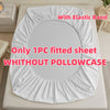 White fitted sheet with an elastic band shown on a bed