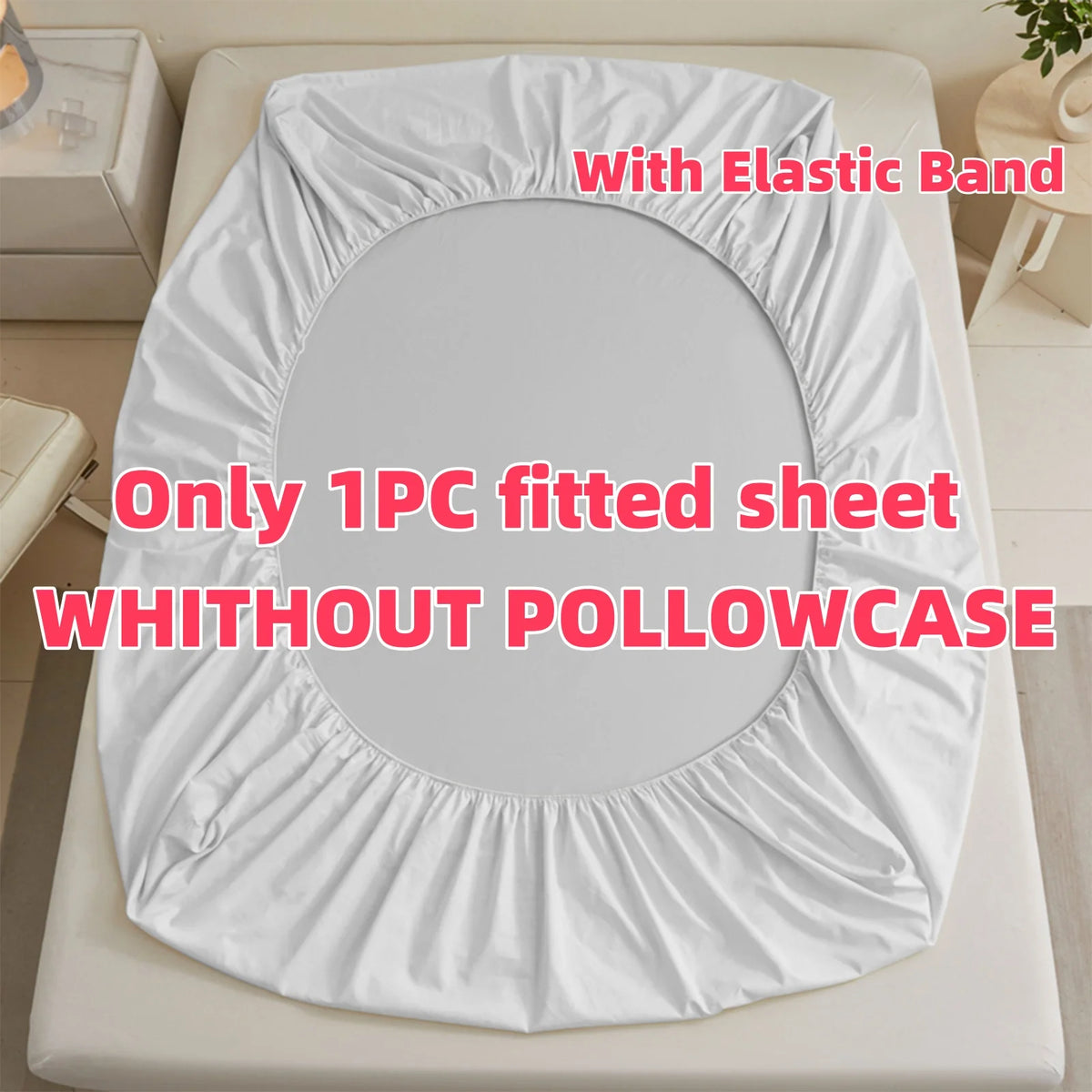 White fitted sheet with an elastic band shown on a bed