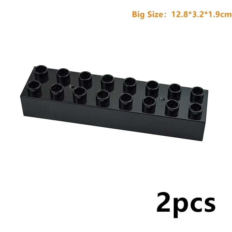 A black set of large building blocks or connectors with multiple cylindrical pieces.