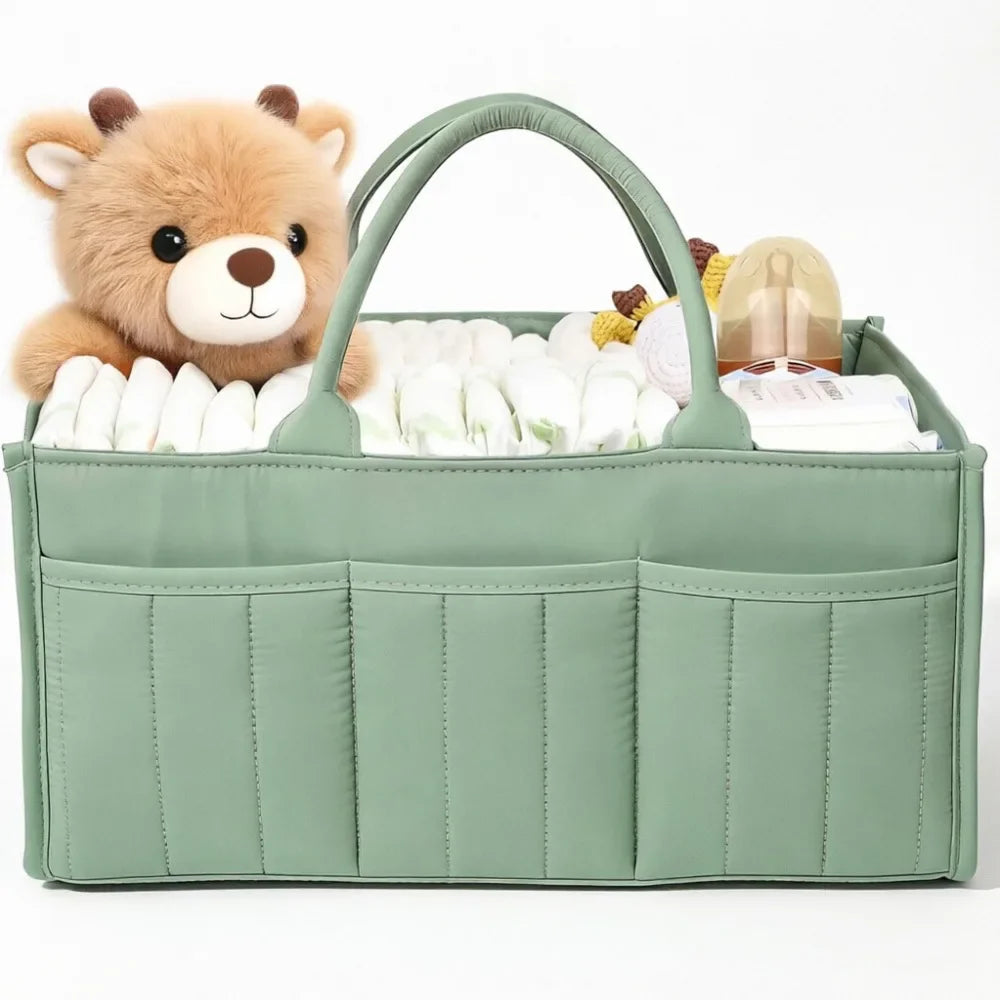 A light green floral diaper organizer bag featuring a bear-shaped pouch and multiple compartments for baby supplies.