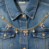 A denim jacket adorned with a gold alloy chain featuring pink bow decorations and hanging charms.