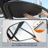 A hand is installing a black electrostatic film sun shade onto a car window.