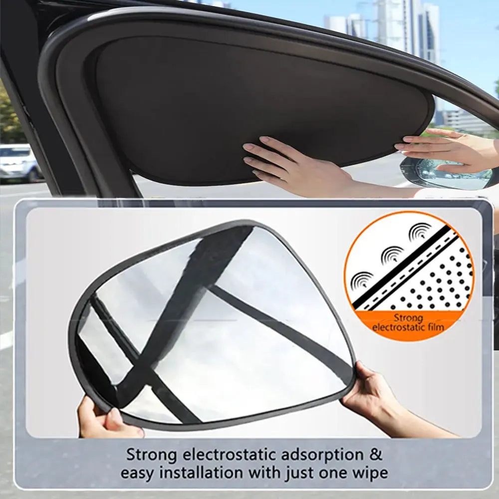 A hand is installing a black electrostatic film sun shade onto a car window.