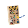 A wooden busy board with various switches and LED lights for a Montessori sensory toy.