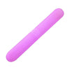 A pink portable toothbrush travel case with a smooth, elongated design.