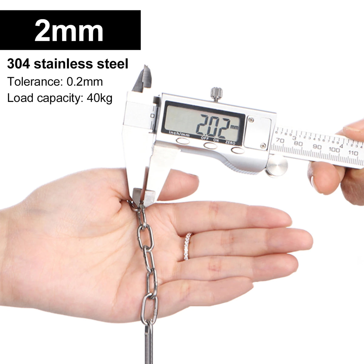A hand holds a digital scale measuring a stainless steel chain, demonstrating its weight capacity.