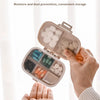 A hand opens a weekly pill organizer with eight compartments to show the independent opening and closing feature.